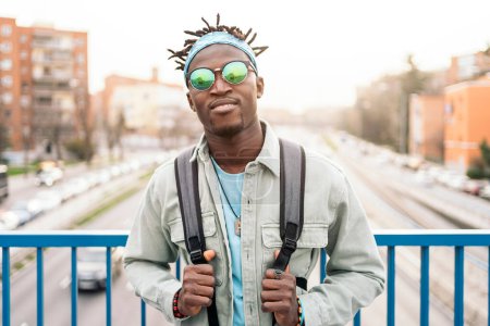 Photo for Handsome and confident african man wearing sunglasses and looking at camera. - Royalty Free Image