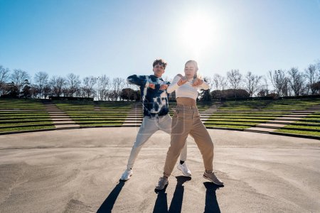 Photo for Stock photo of cool girl and her friend practicing their dance moves and having fun. - Royalty Free Image