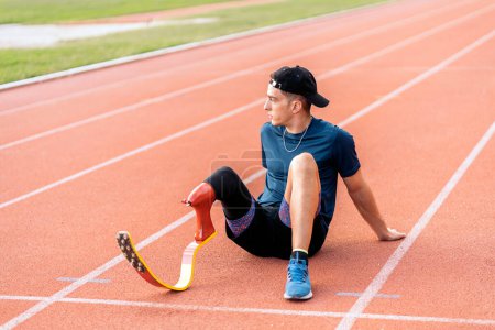 Photo for Stock photo of disabled man athlete taking a break. Paralympic Sport Concept. - Royalty Free Image