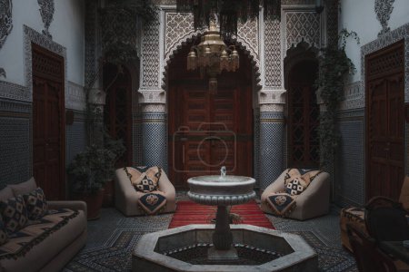 Photo for Interior photography of traditional Moroccan Riad. Landscape orientation of internal coutryard within a old Riad in Marrakech, Morocco. - Royalty Free Image