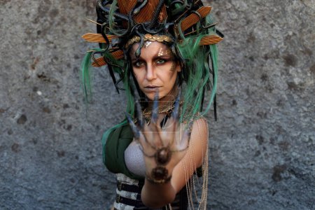 Photo for Lucca, Tuscany, Italy - October 29, 2022: Cosplayer girl dressed as Medusa, character from Greek mythology at the Lucca Comics and Games 2022 cosplay event. - Royalty Free Image