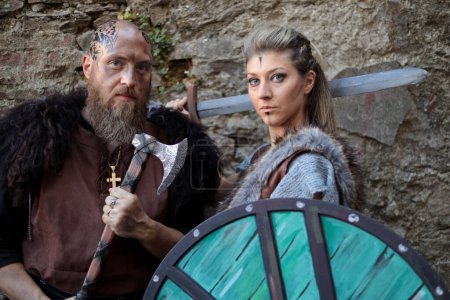 Photo for Lucca, Tuscany, Italy - October 30, 2022: Two Cosplayers dressed as Ragnar and Lagertha, characters from the TV series Vikings at the Lucca Comics and Games 2022 cosplay event. - Royalty Free Image