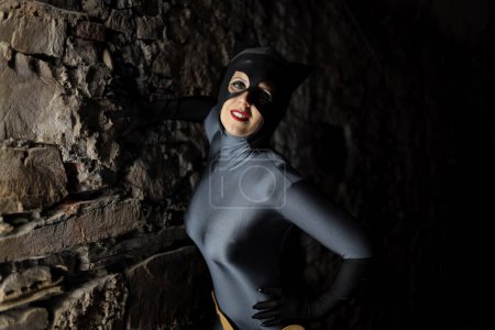 Photo for Lucca, Tuscany, Italy - October 30, 2022: Cosplayer girl dressed as Catwoman at the Lucca Comics and Games 2022 cosplay event. - Royalty Free Image