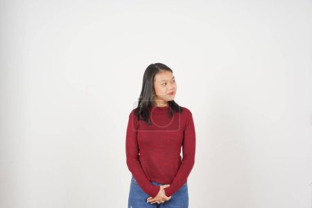 Young Asian woman in Red t-shirt looking aside and smile isolated on white background