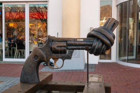 Photo for Cape Town, South Africa. January 01, 2006. Sculpture of a gun with a braided barrel tied in a knot at the Victoria and Alfred, V & A Waterfront Cape Town South Africa, by artist Carl Fredrik Reutersward - Royalty Free Image