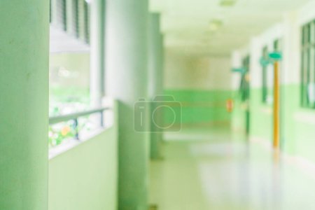 Photo for Defocused abstract background of a hallway with some pillars on the left. Blurred out indoor area background - Royalty Free Image