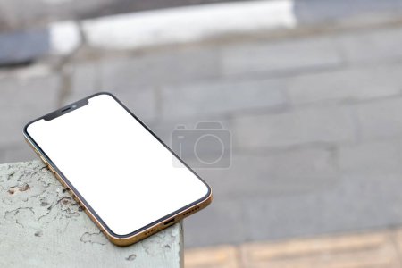 Foto de Image of a mobile phone with blank white screen for mockup showing bricks - Imagen libre de derechos