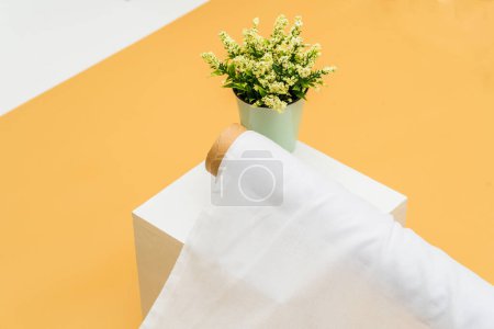 Photo for A mockup purpose is served by the white fabric roll image in a minimalistic set up, creating an appealing and serene ambiance - Royalty Free Image