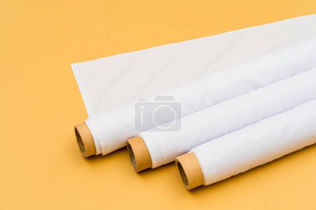Photo for A serene and minimalistic setting complements the allure of a white fabric roll image used for mockup purposes - Royalty Free Image