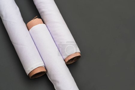 Photo for The sophisticated mockup arrangement accentuates the timeless beauty of the white fabric roll image in a minimalistic backdrop - Royalty Free Image