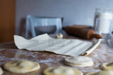 Téléchargez les photos : Kitchen table during dumplings preparation. Spanish traditional apetizer - en image libre de droit
