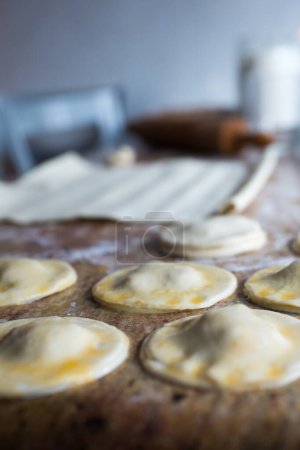 Foto de Kitchen table during dumplings preparation. Spanish traditional apetizer - Imagen libre de derechos