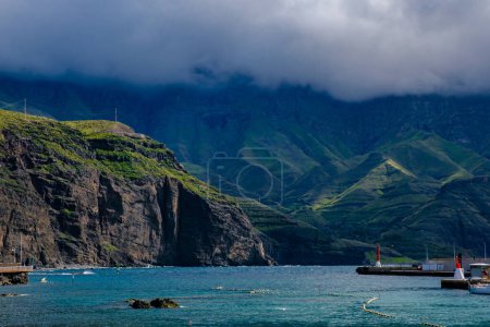 Photo for View in Agaete - Puerto de Las Nieves on Gran Canaria, Spain - Landscape with ocean green hills and white clouds. - Royalty Free Image