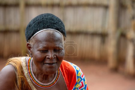 Photo for Manzini, Eswatini, 11 14 2023. Senior woman in a traditional costume worn in a Swazi village in Eswatini South Africa - Royalty Free Image