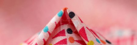 Photo for Close-up of multicolored bright cotton fabric with geometric shapes and figures. Texture background concept - Royalty Free Image