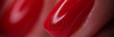 Photo for Close-up of female fingers with red bright glossy varnish. Perfect manicure nails, beauty salon and nail design concept - Royalty Free Image