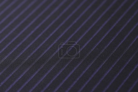 Photo for Black fabric with violet stripes pattern designed for bed linen. High quality textile for sale in store as background. Catalog photo sample - Royalty Free Image