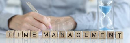 Photo for Close-up of time management words collected with wooden cubes. Work time planning, overtime deadline and delegation of authority concept - Royalty Free Image