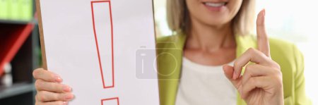 Photo for Portrait of woman holding clipboard with red exclamation point. Interjection and exclamatory concept - Royalty Free Image