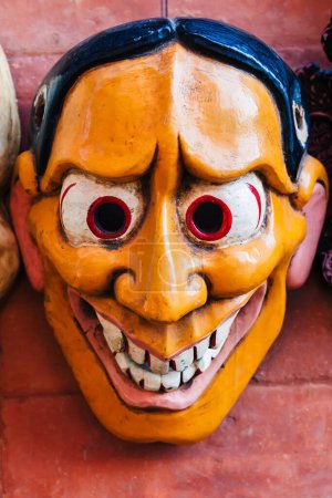 Photo for Colorful wooden mask or handicraft kept for sale at the shop in Swayambhunath, Kathmandu Nepal. - Royalty Free Image