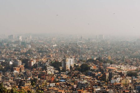 Photo for Kathmandu, The Capital of Nepal Seen from The Monkey Temple Kathmandu on a Foggy Day. Cloudy day - Royalty Free Image