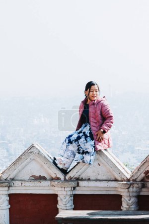 Photo for An Woman Posing for a Photograph in Swayambhunath Stupa, Kathmandu - Royalty Free Image