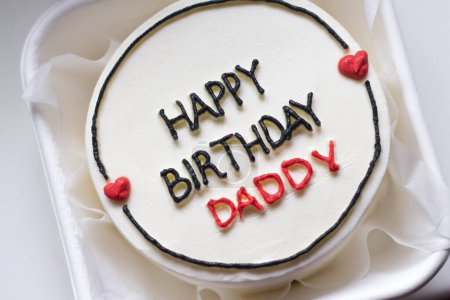 Happy birthday cake. Happy birthday cake background. Happy birthday cake on a white background. Birthday cake for dad with the words "Happy birthday daddy". White birthday cake. High quality photo