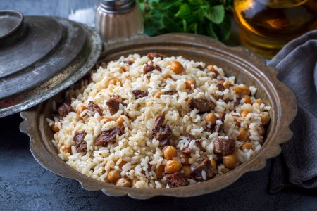 Photo for Traditional Turkish food; Roasted meat on rice (Turkish name; pilav ustu kavurma, kurban kavurma, nohutlu etli pilav) - Royalty Free Image