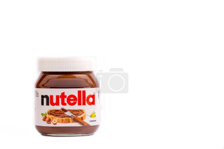 Photo for Izmir - Turkey, 04-04-2022, Nutella jar against isolated on a white background. Nutella is manufactured by the Italian company Ferrero and was first introduced in 1965. With clipping path. - Royalty Free Image