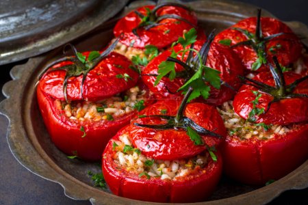 Foto de Traditional Turkish food; Stuffed tomatoes with olive oil stuffed with rice. Turkish name; domates dolmasi - Imagen libre de derechos