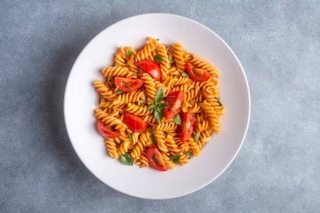 Photo for Fusilli pasta, spiral or spirali pasta with tomato sauce - Italian food style - Royalty Free Image