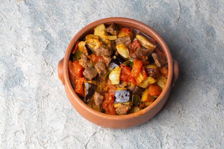 Photo for Traditional Turkish cuisine; Meaty Eggplant Dish. Turkish name; patlican guvec or patlican tava - Royalty Free Image