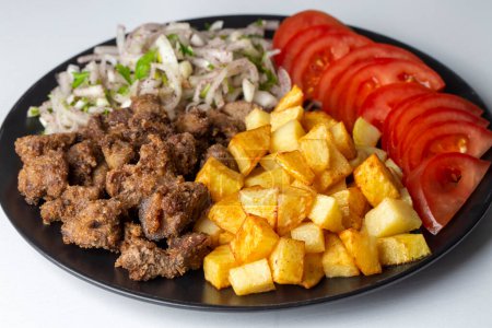 Foto de Pan de hígado (hígado albanés) comida tradicional turca. Hígado sobre arroz. (Nombre turco; arnavut ciger) - Imagen libre de derechos