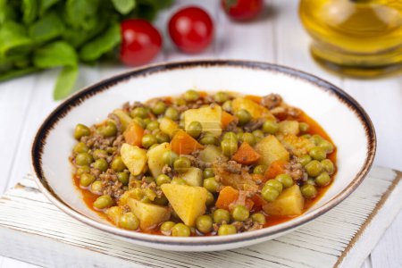 Photo for Traditional delicious Turkish food; Peas with minced meat (Turkish name; Kiymali bezelye yemegi) - Royalty Free Image