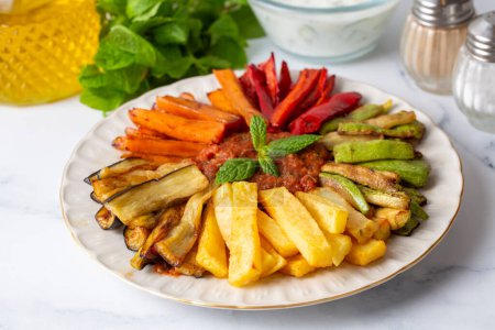 Photo for Turkish style mixed vegetable fried with yoghurt (Yogurtlu Karisik Kizartma) - Royalty Free Image