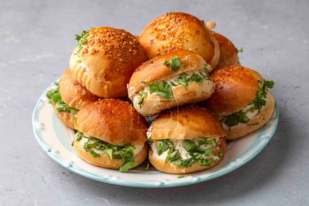 Photo for Turkish pastry filled with dill, parsley, cream cheese and cheddar cheese. Turkish name: Sakall Pogaca or Sacakli Pogaca - Royalty Free Image