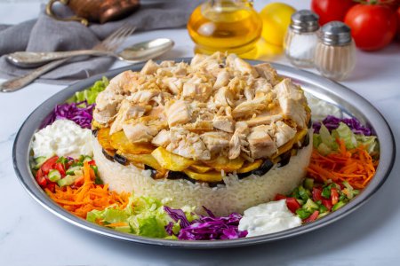 Photo for Middle Eastern food culture, Turkish cuisine; type of pilaf, pilaf with chicken and vegetables, Turkish name; Maklube, tavuklu maklube - Royalty Free Image