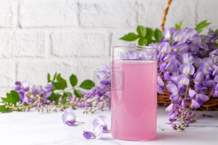 Photo for Drink for health made from Wisteria sinensis flower. Wisteria sinensis sherbet. Turkish name; Mor salkim serbeti - Royalty Free Image