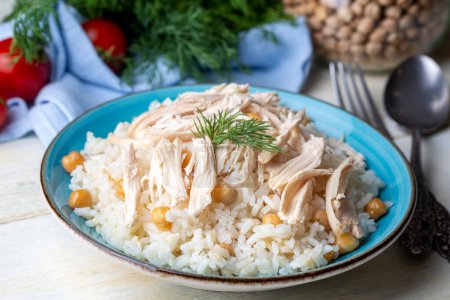 Photo for Traditional delicious Turkish food; Rice with chickpeas and chicken (Turkish name; Tavuklu nohutlu pilav or pilaf) - Royalty Free Image