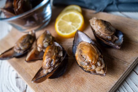 Photo for Turkish Street Food Stuffed Mussels with Lemon - Midye Dolma - Royalty Free Image