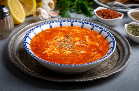 Photo for Chicken noodle soup with tomato. Turkish name; Domatesli tavuklu sehriye corbasi - Royalty Free Image