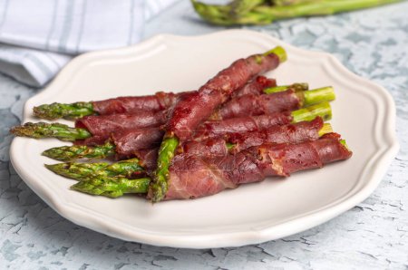 Photo for Grilled asparagus with bacon (Turkish name; Pastirmali kuskonmaz izgara) - Royalty Free Image