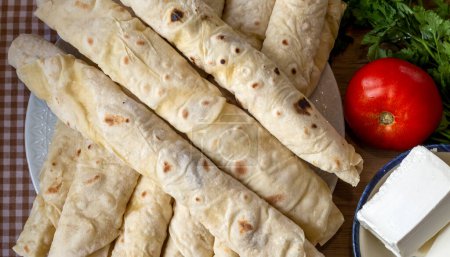 Photo for Traditional, local Turkish food; cheese pastry wrap (Turkish name; Sikma) - Royalty Free Image