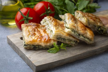 Photo for Greek cuisine; Spinach Tart or Spinach Pie. Turkish name; ispanakli borek or ispanakli tart - Royalty Free Image