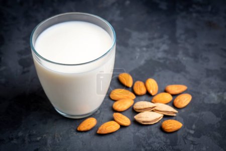 Photo for Glass of Almond milk and almond nuts - Royalty Free Image