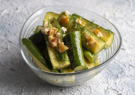 Photo for Green zucchini salad with walnuts and dill - Royalty Free Image
