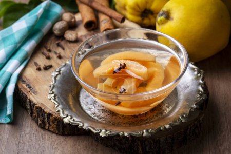 Photo for Quince compote. Compote or compote is a type of dessert prepared by boiling fruits with sugar water. Turkish name; ayva kompostosu - Royalty Free Image
