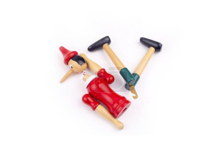 Photo for Toy Puppet Broken Pinocchio on White Background - Royalty Free Image