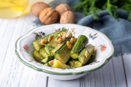 Photo for Green zucchini salad with walnuts and dill, Turkish appetizer - meze - Royalty Free Image