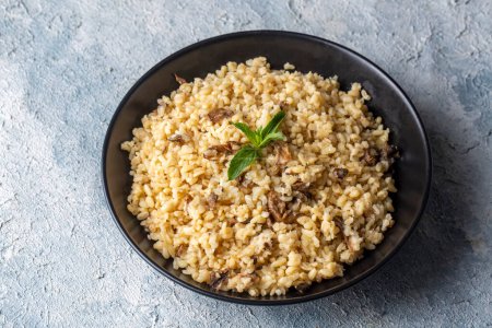 Photo for Bulgur pilaf with mushrooms, food concept photo. - Royalty Free Image